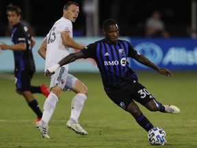 The Impact’s Romell Quioto passes the ball during a 1-0 win over D.C. United Tuesday night at the MLS is Back Tournament at the ESPN Wide World of Sports Complex in Reunion, Fla.