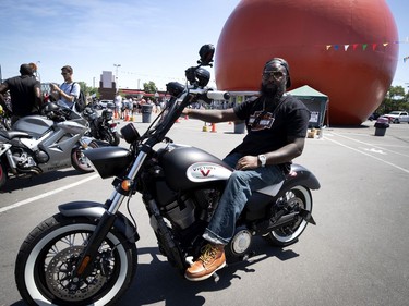 Pierre Louis joins a group of motorcyclists to take part in a motorcade to voice their support for the anti-racism movement, in Montreal, on Saturday, July 4, 2020. (Allen McInnis / MONTREAL GAZETTE)