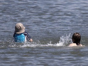 Kids play in the water as they cool off in the St. Lawrence River in Montreal on Friday, July 24, 2020. More than 50 per cent of drowning deaths in children under 14 are in residential swimming pools.