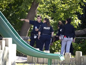 Police investigate the scene of a shooting in Laval on July 30, 2020.