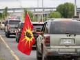 Mohawks from Kahnawake on Montreal’s South Shore stage a rolling protest on Route 132 to the Mercier Bridge on Saturday, July 11, 2020, to mark the anniversary of the start of 1990 Oka Crisis.