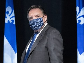 Quebec Premier Francois Legault arrives at a news conference in Montreal, on Friday, May 15, 2020.