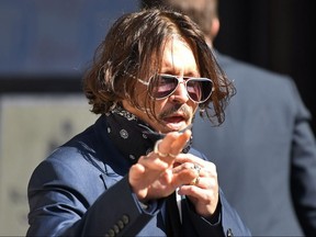 Johnny Depp arrives on the first day of his libel trial against News Group Newspapers (NGN), at the High Court in London, on July 7, 2020.
