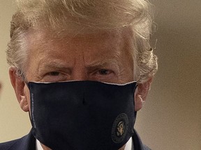 U.S. President Donald Trump wears a mask while visiting Walter Reed National Military Medical Center in Bethesda, Md, on Saturday, July 11, 2020.