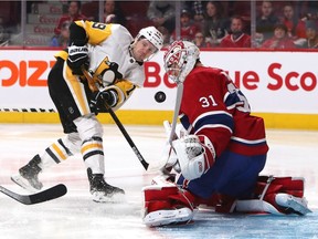 Canadiens goalie Carey Price makes save on Pittsburgh Penguins' Jared McCann during game at the Bell Centre on Jan. 4, 2020. The Penguins won 3-2 in overtime.