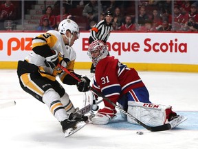 Canadiens goalie Carey Price makes a save against the Pittsburgh Penguins' Brandon Tanev during game at the Bell Centre in Montreal on Jan. 4, 2020.