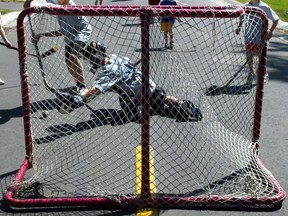 Will the government revise its guidelines for competitive sports following the hockey camp outbreak in Montreal and one at a Mirabel ball hockey tournament?