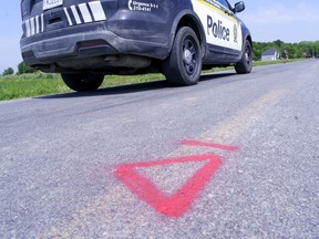 A police car drives along le Rang Sainte-Anne in Notre-Dame-de-Stanbridge on Thursday, July 2, 2020 where three children aged five and under died following a tractor accident Wednesday evening.