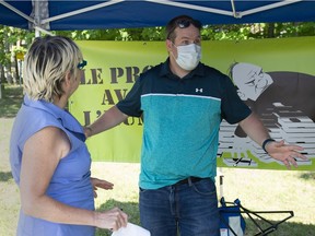 Paul-André Caron, union representative at four Chartwell senior homes, chats with union leader Sylvie Nelson on Friday.