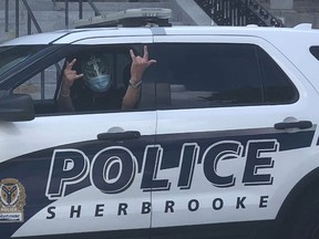 Sherbrooke police are investigating after an officer was photographed inside a cruiser wearing a wrestling mask during a protest over the weekend.