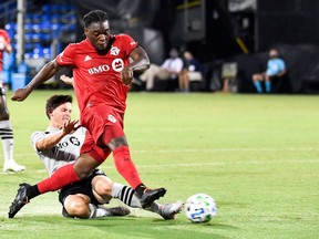 Toronto FC forward Ayo Akinola shoots and scores one of his three goals Thursday night during the first half against the Impact at ESPN's Wide World of Sports complex in Reunion, Fla.