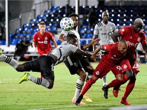 FC defender Auro (96) and Montreal Impact defender Zachary Brault-Guillard (15) fight for the ball during the second half on July 16, 2020, in Reunion, Fla.