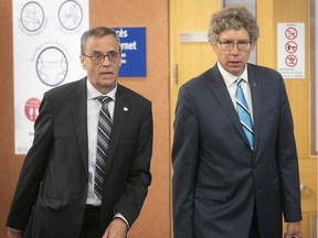 Quebec English School Board Association president Dan Lamoureux and Russell Copeman, leave courtroom during court session on in Quebec on Tuesday June 23, 2020, during arguments seeking an injunction on Bill 40, the CAQ government's legislation to eliminate school boards.