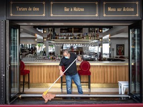 Le Pois Penche employee Mamoun Ghanmeh prepares the restaurant for opening in July 2020.