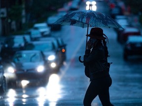 Montrealers took to the streets with umbrellas on Tuesday August 4, 2020 as rainfall is a result of hurricane Isaias making its way up east coast of the United States. Dave Sidaway / Montreal Gazette ORG XMIT: 64826