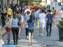 People walk on the pedestrian zone on St-Catherine St. in Montreal Wednesday August 5, 2020. 