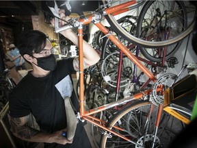 Lamar Timmins with some of the bikes he has work to do on, at his bike shop in Griffintown on Monday Aug. 17, 2020. Timmins says that the prices of second hand bikes has gone up this summer.