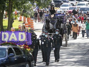 Grand Chief Joe Norton's funeral cortège makes its way through Kahnawake on Wednesday.
