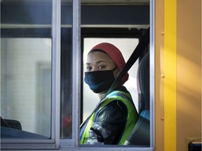 A school bus driver waits to drop students at Bancroft Elementary School in Montreal, on Monday, August 31, 2020. (Allen McInnis / MONTREAL GAZETTE)