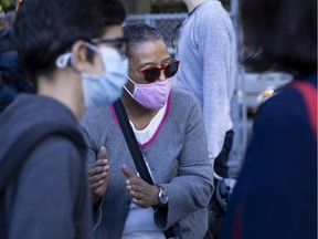 EMSB trustee Marlene Jennings speaks with students and parents at Bancroft Elementary School in Montreal Aug. 31, 2020.