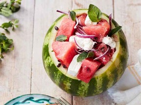 You can use a hollowed-out watermelon as a bowl for a salad that includes feta and red onion.