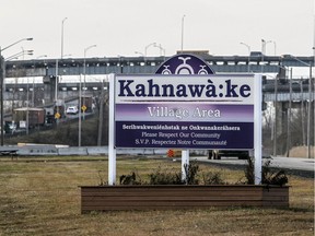 A sign at the entrance to the village area of Kahnawake on December 10, 2015.