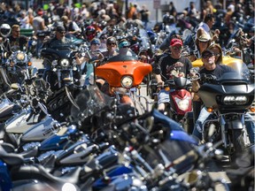 Motorcyclists ride down Main St. during the 80th Annual Sturgis Motorcycle Rally on Aug. 7, 2020, in Sturgis, S.D. While the rally usually attracts about 500,000 people, officials estimate more than 250,000 people may still show up to this year's festival despite the coronavirus pandemic.