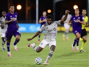Impact's Orji Okwonkwo fired a shot during the first half of their game against Orlando City during the MLS is Back tournament in July.