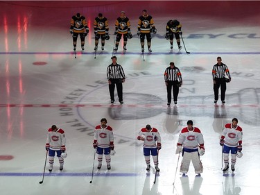 The Montreal Canadiens and the Pittsburgh Penguins stand for the Canadian national anthem before they begin Game One of the Eastern Conference Qualification Round prior to the 2020 NHL Stanley Cup Playoffs at Scotiabank Arena on August 01, 2020 in Toronto, Ontario.