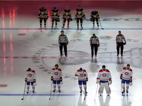 The Montreal Canadiens and the Pittsburgh Penguins stand for the Canadian national anthem before they begin Game One of the Eastern Conference Qualification Round prior to the 2020 NHL Stanley Cup Playoffs at Scotiabank Arena on August 01, 2020 in Toronto, Ontario.