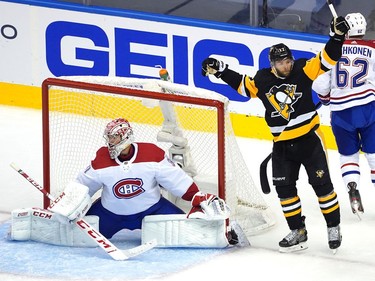 Bryan Rust #17 of the Pittsburgh Penguins celebrates his goal in the second period as Carey Price #31 of the Montreal Canadiens looks on during Game One of the Eastern Conference Qualification Round prior to the 2020 NHL Stanley Cup Playoffs at Scotiabank Arena on August 01, 2020 in Toronto, Ontario.