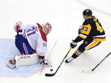 Conor Sheary #43 of the Pittsburgh Penguins is blocked by Carey Price #31 of the Montreal Canadiens in the third period during Game One of the Eastern Conference Qualification Round prior to the 2020 NHL Stanley Cup Playoffs at Scotiabank Arena on August 01, 2020 in Toronto, Ontario.