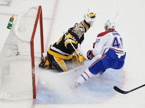 Matt Murray #30 of the Pittsburgh Penguins makes a glove save in front of Joel Armia #40 of the Montreal Canadiens in Game Two of the Eastern Conference Qualification Round prior to the 2020 NHL Stanley Cup Playoffs at Scotiabank Arena on August 03, 2020 in Toronto, Ontario.
