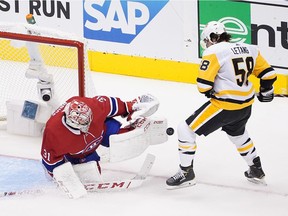 Carey Price of the Montreal Canadiens makes a pad save on Kris Letang of the Pittsburgh Penguins in Game 3 of the Eastern Conference Qualification Round at Scotiabank Arena on Aug. 5, 2020, in Toronto.