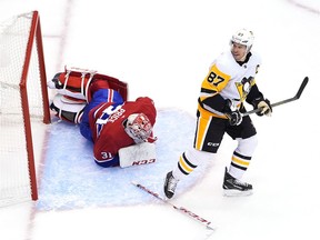 Penguins' Sidney Crosby skates off after he knocked over Canadiens' Carey Price  in the second period in Game Four of the Eastern Conference Qualification Round prior to the 2020 NHL Stanley Cup Playoffs at Scotiabank Arena on Friday, Aug. 7, 2020, in Toronto.