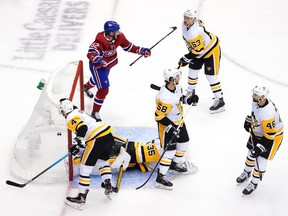 Canadiens' Artturi Lehkonen celebrates his winning goal as goalie Tristan Jarry, Justin Schultz #4, Kris Letang #58, Teddy Blueger #53 and Zach Aston-Reese #46 of the Penguins look on Friday evening in Toronto.