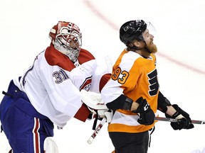 Canadiens goalie Carey Price shoves Philadelphia Flyers forward Jakub Voracek during Game 1 of their playoff series Wednesday night at Toronto’s Scotiabank Arena.