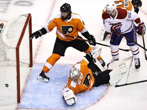 TORONTO, ONTARIO - AUGUST 12: Carter Hart #79 of the Philadelphia Flyers is unable to stop a shot from Shea Weber of the Montreal Canadiens as Ivan Provorov #9 of the Philadelphia Flyers and Jonathan Drouin #92 of the Montreal Canadiens stand by in the second period in Game One of the Eastern Conference First Round during the 2020 NHL Stanley Cup Playoffs at Scotiabank Arena on August 12, 2020 in Toronto, Ontario.