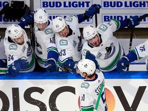 Troy Stecher celebrates his goal at 5:36 of the third period against the St. Louis Blues in Game One of the Western Conference First Round.