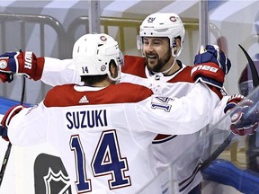 Canadiens' Tomas Tatar and Nick Suzuki celebrate after the first of Tatar's two goals Friday at Scotiabank Arena in Toronto.