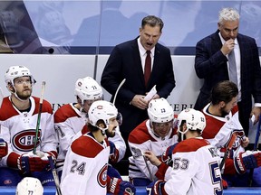 Associate Coach Kirk Muller (top left) of the Montreal Canadiens shouts from the bench against the Philadelphia Flyers during the first period in Game 2 at Scotiabank Arena in Toronto on Aug. 14, 2020.