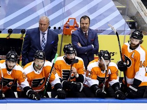 Flyers head coach Alain Vigneault, right, and assistant coach Michel Therrien look on in disgust during Philadelphia's 5-0 loss to the Canadiens Friday afternoon in Toronto.