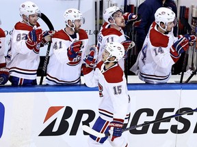 The Canadiens’ Jesperi Kotkaniemi celebrates with teammates on the bench after scoring his second goal of the game during 5-0 win over the Philadelphia Flyers in Game 2 of their playoff series Friday afternoon at Toronto’s Scotiabank Arena.