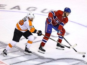 Canadiens' Jesperi Kotkaniemi eludes Flyers' Claude Giroux during Game 3 of the Eastern Conference quarter-finals in Toronto.