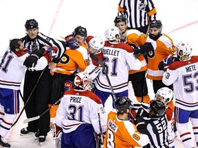 Players from the Canadiens and Philadelphia Flyers mix it up late in third period of Game 5 in their first-round playoff series, which Montreal won 5-3 to avoid elimination.