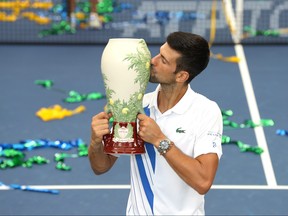 Novak Djokovic of Serbia kisses the trophy after defeating Milos Raonic of Canada in their Men's Singles Final match of the 2020 Western & Southern Open at USTA Billie Jean King National Tennis Center on Saturday, Aug. 29, 2020, in the Queens borough of New York City.