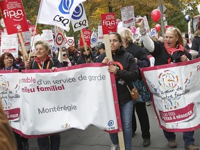 FIPEQ-CSQ, representing home daycare workers across Quebec, engage in a march in 2014.