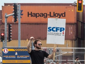 After two four-day walk-outs to protest stalled contract talks, dockworkers at the Port of Montreal launched an unlimited strike in Montreal on Monday Aug. 10, 2020.