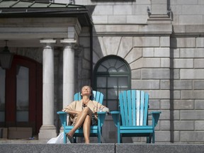 Caroline Tuchscherer enjoys a sun-soaked break in a quiet Old Montreal on Monday, August 10, 2020.