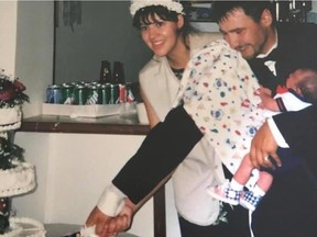 Tomas Jirousek's parents, Ann and Jakub Jirousek, cut their wedding cake after their marriage on the Blood reserve in Alberta in 1998. Jakub is holding one-month-old Tomas.